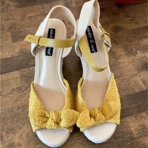 Cute yellow and straw wedges. Size 6. Never worn.